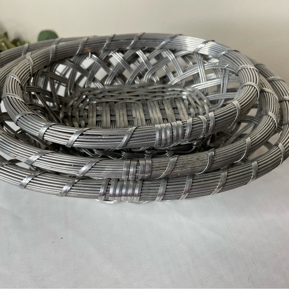 3 beautiful woven wire metal nesting baskets.